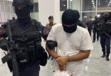 Third Bangkok Bombing Suspect Arrested Muhammad Ilham Saeed being escorted by police commandos to Crime Suppression Division headquarters on Sept. 2.