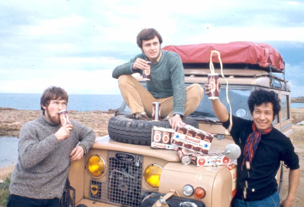 Simon Richard, George Emsden, and Anussorn Thavisin take a beer break in Italy during their 1970s overland trip from the UK to Bangkok. Photo: David Shaw / Courtesy