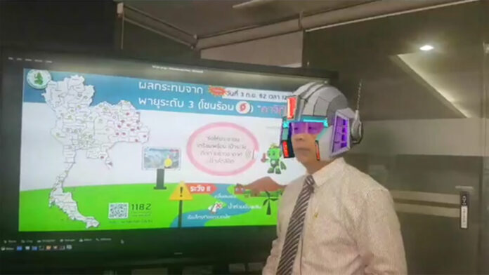 A screenshot from the Facebook live video on Sept. 2 showing Phuwieng Phrakhammintara with robotic augmented reality filter over his head. Image: the Meteorological Department / Facebook A screenshot from the Facebook live video on Sept. 2 showing Phuwieng Phrakhammintara with robotic augmented reality filter over his head. Image: the Meteorological Department / Facebook