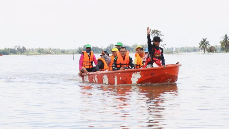 Rescue workers ride boats Sept. 15, 2019 in Wang-on Village in Roi Et province.