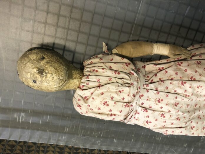 This Friday, Oct. 11, 2019 photo provided by Christine Rule shows a vintage doll that is part of the creepiest dolls collection at the History Center of Olmsted County in Rochester, Minn. (Christine Rule via AP)