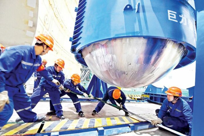 Technicians install equipment at Fuqing nuclear power plant in Fujian province in 2018. Image: Xinhua