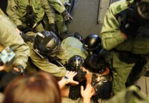 Officer Slashed in Neck by Rioter Still in ICU: Hong Kong Police