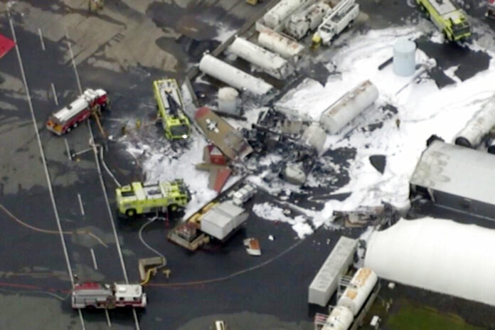 In this aerial image taken from video, emergency crews respond to where a World War II-era bomber B-17 plane crashed at Bradley International Airport in Windsor Locks, Conn., Wednesday, Oct. 2, 2019. Photo: WFXT Boston 25 News via AP