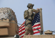 US May Now Keep Some Troops in Syria to Guard Oilfields American soldier mount the U.S. flag on a vehicle near the town of Tel Tamr, north Syria, Sunday, Oct. 20, 2019. Kurdish-led fighters and Turkish-backed forces clashed sporadically Sunday in northeastern Syria amid efforts to work out a Kurdish evacuation from a besieged border town, the first pull-back under the terms of a U.S.-brokered cease-fire. Photo: Baderkhan Ahmad / AP