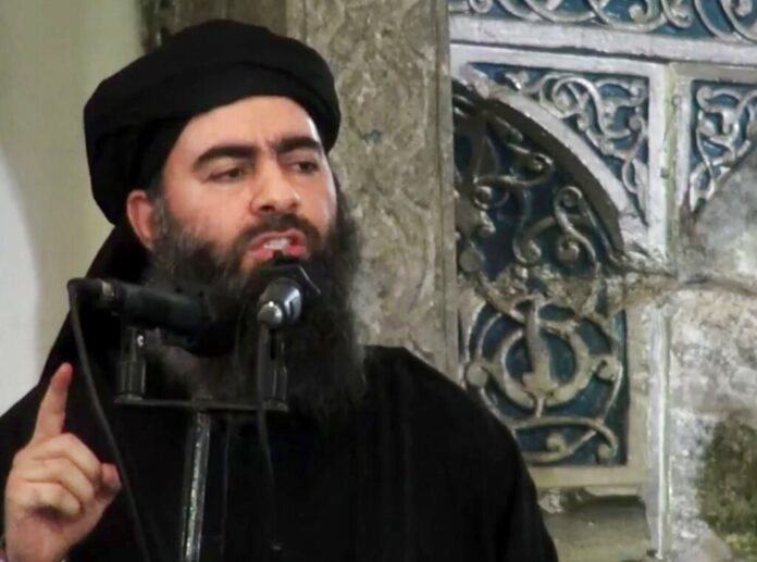 This file image made from video posted on a militant website Saturday, July 5, 2014, purports to show the leader of the Islamic State group, Abu Bakr al-Baghdadi, delivering a sermon at a mosque in Iraq during his first public appearance. Photo: Militant video, File