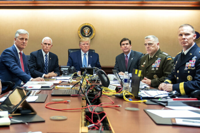 In this photo provided by the White House, President Donald Trump is joined by from left, national security adviser Robert O'Brien, Vice President Mike Pence, Defense Secretary mark Esper, Joint Chiefs Chairman Gen. Mark Milley and Brig. Gen. Marcus Evans, Deputy Director for Special Operations on the Joint Staff, Saturday, Oct. 26, 2019, in the Situation Room of the White House in Washington. Photo: Shealah Craighead / The White House via AP