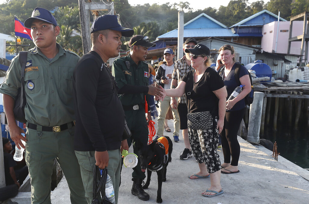 Family members of missing British backpacker Amelia Bambridge, right, shake hands with provincial police officers on a pier on Koh Rong island off southwestern Cambodia, Wednesday, Oct. 30, 2019. British national Phil Bambridge, center, the father of missing backpacker Amelia Bambridge, sits with his family during a meeting with the governor of Koh Rong City Noun Bunthol, unseen, after a day of searching off Koh Rong island in southwestern Cambodia, Wednesday, Oct. 30, 2019. Photo: Heng Sinith / AP