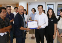 Art Enthusiasts Demand Answers Behind BACC Director Sacking Chatvichai Promadhattavedi, left, secretary of the BACC foundation, receiving petition letter from Chayan Chaiyaporn, right, campaign leader at the Bangkok Art and Cultural Center on Oct. 9, 2019.