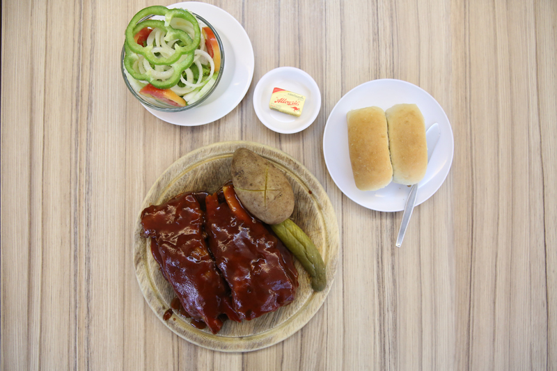 Barbeque spare ribs (280 baht) served with butter rolls (60 baht)