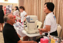 Health Insurance Will Be Mandatory for Retiree Visa Holders A foreigner gets a health check at an expo in Phuket province on Nov. 16, 2016. Photo: Bangkok Hospital Phuket