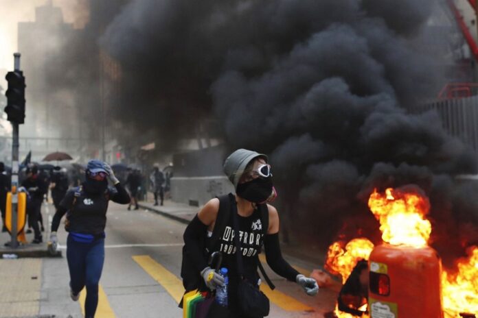 Protesters in Hong Kong on Oct. 1, 2019. (AP Photo/Gemunu Amarasinghe)