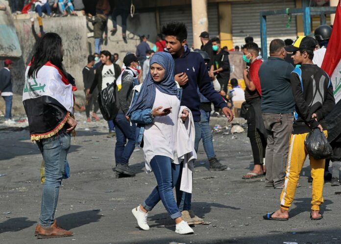 Anti-government protesters gather on Rasheed Street in Baghdad, Iraq, Wednesday, Nov. 27, 2019. (AP Photo/Khalid Mohammed)