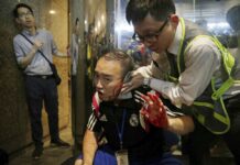 Hong Kong Attacker Bites Politician’s Ear, Xinhua Office Trashed