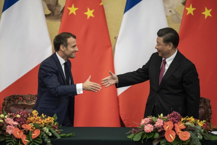 French President Emmanuel Macron, left, shakes hands with Chinese President Xi Jinping following a signing ceremony at the Great Hall of the People in Beijing, Wednesday, Nov. 6, 2019. (Nicolas Asfouri/Pool Photo via AP)