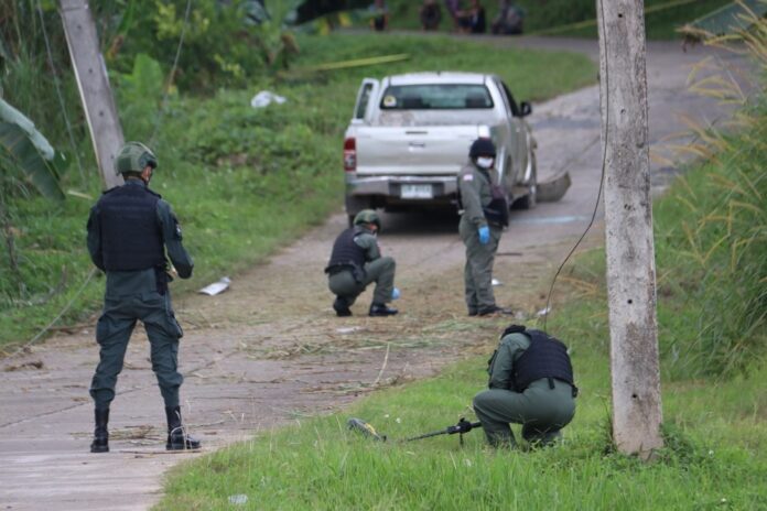Security officers investigate a suspected insurgent attack in Yala province on Oct. 28, 2019.