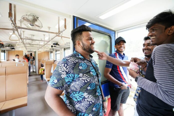 People travel by a Chinese-made train in Sri Lanka, Nov. 2, 2019. (Xinhua/Tang Lu)