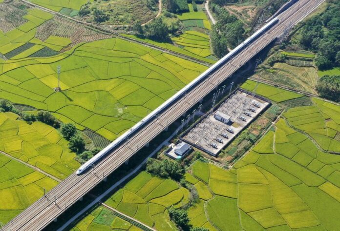 Photo taken on Oct. 29, 2019 shows a bullet train running through the fields of Gula Township of Binyang County, south China's Guangxi Zhuang Autonomous Region. (Xinhua/Lu Boan)