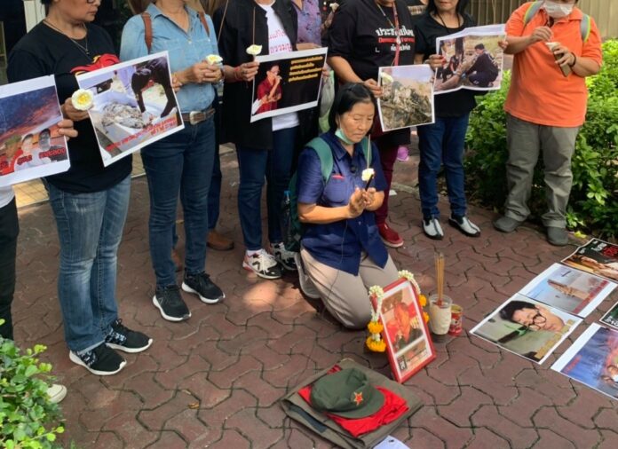 Wife of missing republican activist Surachai Danwattanusorn leads a rally on Oct. 10, 2019, at the police HQ in Bangkok, urging the authorities to come clean about his fate.