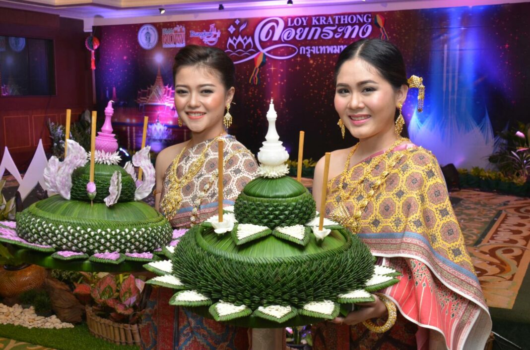 Promotional models pose for photos at a government event promoting Loy Krathong festival in Bangkok on Oct. 30, 2018.