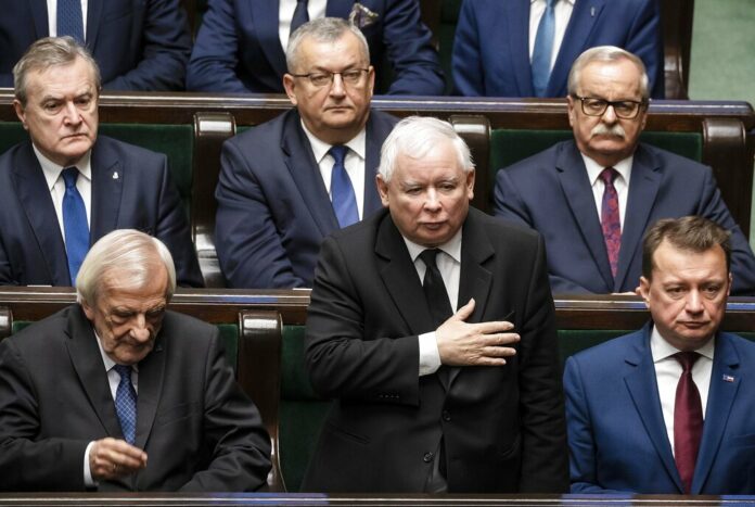 The leader of Poland's ruling right-wing Law and Justice party, Jaroslaw Kaczynski, center, swears in as a member of the parliament during a gala inauguration of a new four-year term of the national parliament in Warsaw, Poland, Tuesday, Nov. 12, 2019. Photo: AP The leader of Poland's ruling right-wing Law and Justice party, Jaroslaw Kaczynski, center, swears in as a member of the parliament during a gala inauguration of a new four-year term of the national parliament in Warsaw, Poland, Tuesday, Nov. 12, 2019. Photo: AP