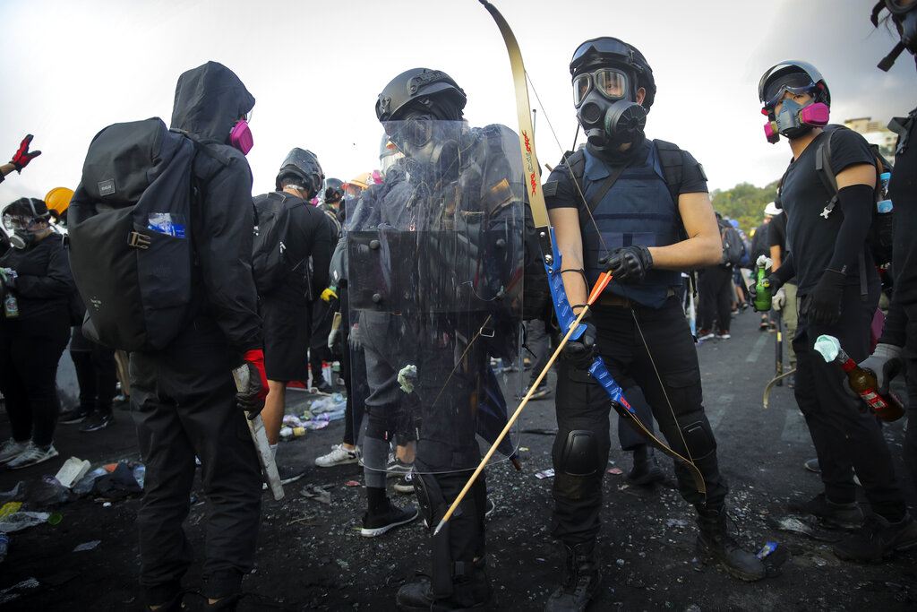 Students with their homemade gears take their position outside the Chinese University of Hong Kong, in Hong Kong, Wednesday, Nov. 13, 2019. Protesters in Hong Kong battled police on multiple fronts on Tuesday, from major disruptions during the morning rush hour to a late-night standoff at a prominent university, as the 5-month-old anti-government movement takes an increasingly violent turn. Photo: Kin Cheung / AP