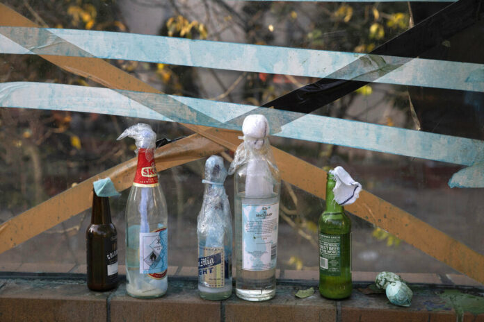 Molotov cocktails are left over at the Hong Kong Polytechnic University campus in Hong Kong on Tuesday, Nov. 19, 2019. Police tightened their siege of the university campus where hundreds of protesters remained trapped overnight Tuesday in the latest dramatic episode in months of protests against growing Chinese control over the semi-autonomous city. Photo: Ng Han Guan / AP