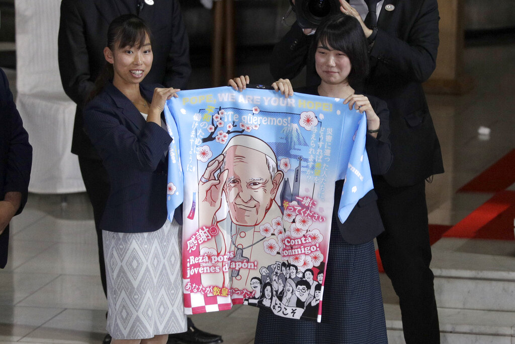 Young participants present Pope Francis with a traditional Japanese coats known as "happi" while he visit at the Cathedral of Holy Mary Monday, Nov. 25, 2019, in Tokyo, Japan. Photo: Gregorio Borgia / AP