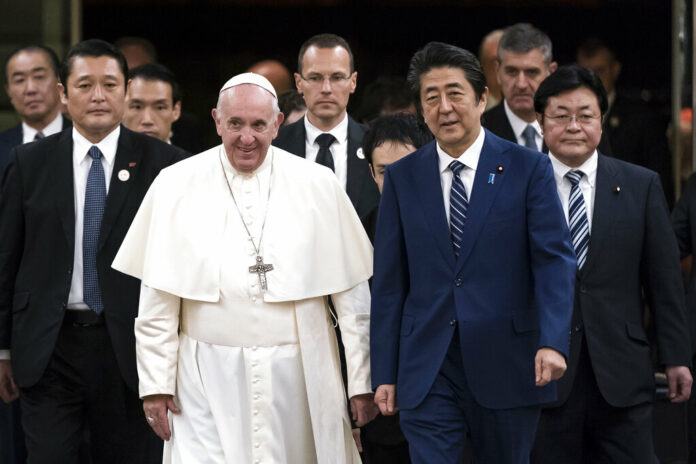 Pope Francis walks with Japan's Prime Minister Shinzo Abe as he arrives at the prime minister's official residence Monday, Nov. 25, 2019 in Tokyo. Photo: Tomohiro Ohsumi/Pool Photo via AP