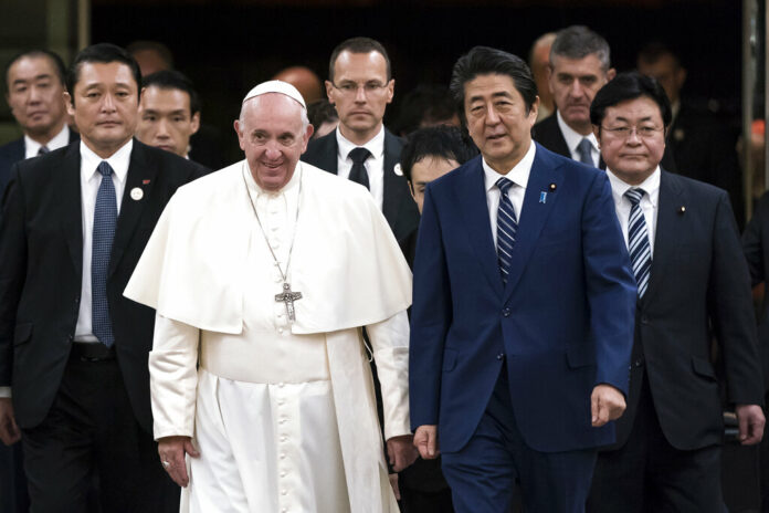 Pope Francis walks with Japan's Prime Minister Shinzo Abe as he arrives at the prime minister's official residence Monday, Nov. 25, 2019 in Tokyo. Photo: Tomohiro Ohsumi/Pool Photo via AP Pope Francis walks with Japan's Prime Minister Shinzo Abe as he arrives at the prime minister's official residence Monday, Nov. 25, 2019 in Tokyo. Photo: Tomohiro Ohsumi/Pool Photo via AP