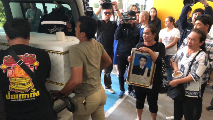 Relatives of the plaintiff's lawyer Wijai Sukharom collecting his body from a hospital on Nov. 13, 2019.