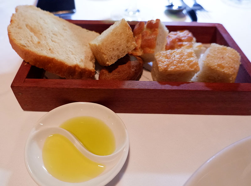 Bread, including a potato foccacia, served with two types of olive oil at Enoteca.