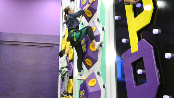“SuperClimb” climbing wall.