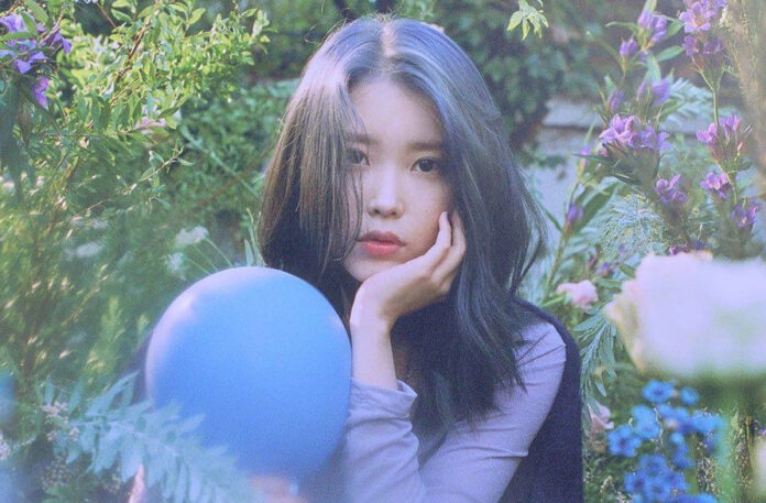 IU in a promotional photo for her Love Poem extended play.
