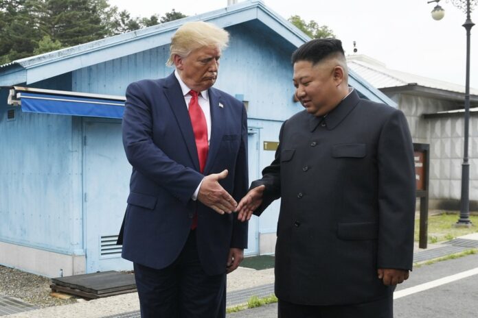 In this June 30, 2019 file photo, President Donald Trump meets with North Korean leader Kim Jong Un at the border village of Panmunjom in the Demilitarized Zone, South Korea. President Donald Trump starts the new year knee-deep in daunting foreign policy challenges at the same time he'll have to deal with a likely impeachment trial in the Senate and the demands of a reelection campaign. (AP Photo/Susan Walsh, File)
