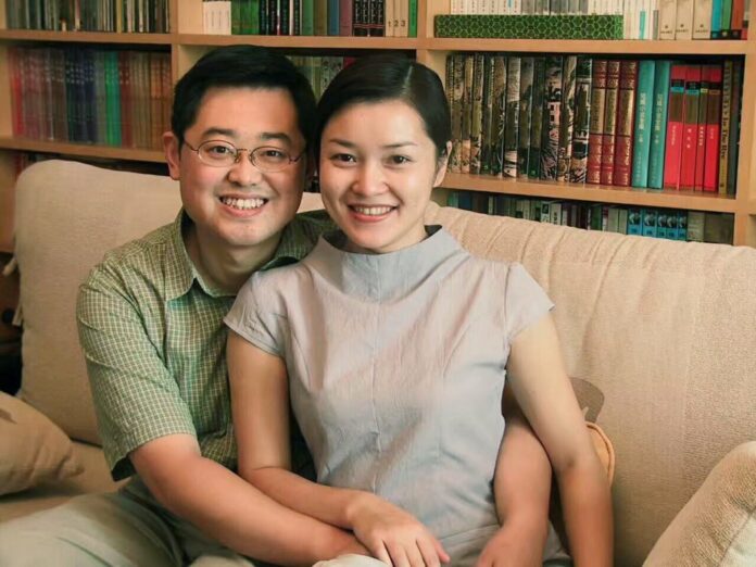 In this 2000 photo provided by ChinaAid, pastor Wang Yi, left, poses with his wife Jiang Rong at the study room of their home in Chengdu, China. (ChinaAid via AP)