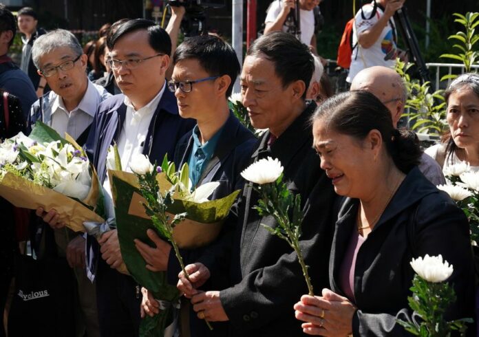 The son (3rd L) and relatives of the 70-year-old street cleaner killed by rioters attend a mourning ceremony in Hong Kong, south China, Nov. 22, 2019. (Xinhua)