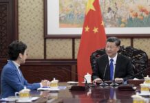 Xi Reaffirms Support for Hong Kong Chief Despite Protests