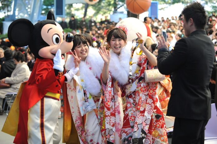 Young girls dressed in traditional kimonos attend the annual Coming-of-Age Day ceremony at the Tokyo Disneyland in Urayasu, suburban Tokyo, Japan, Jan. 12, 2015. (Xinhua/Stringer)