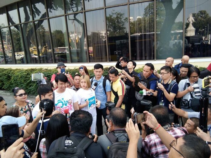 Activist speak to reporters outside Royal Rattanakosin Hotel on Ratchadamnoen Avenue, Dec. 16, 2019.