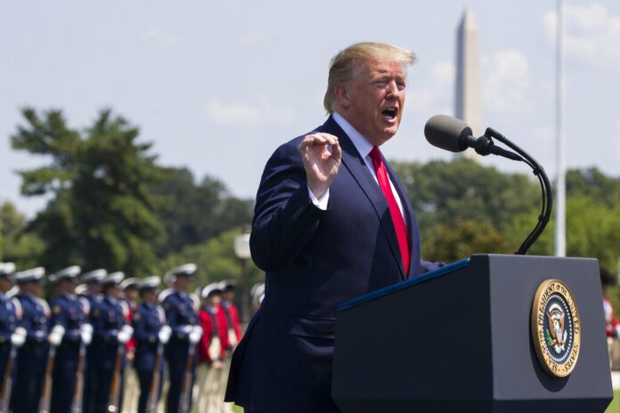 In this July 25, 2019, file phot, President Donald Trump speaks during a ceremony for new Secretary of Defense Mark Esper at the Pentagon. If there was one day that crystallized all the forces that led to the impeachment investigation of President Donald Trump, it was July 25. That was the day of his phone call with Ukraine’s new leader, pressing him for a political favor. Photo: Alex Brandon, File / AP