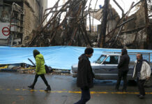 Amnesty Says at Least 208 Killed in Iran Protests, Crackdown In this Nov. 20, 2019, file photo, people walk past buildings that were burned during recent protests, in Shahriar, Iran, some 40 kilometers (25 miles) southwest of the capital, Tehran. Amnesty International says at least 208 people in Iran have been killed amid protests over sharply rising gasoline prices and a subsequent crackdown by security forces. The country has yet to release any nationwide statistics about the unrest last month. Photo: Vahid Salemi, File / AP