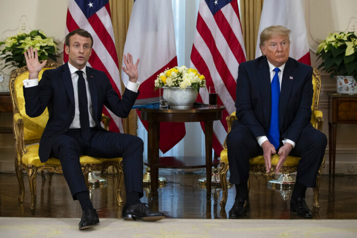 President Donald Trump listens as French President Emmanuel Macron speaks during a meeting at Winfield House during the NATO summit, Tuesday, Dec. 3, 2019, in London. Photo: Evan Vucci / AP