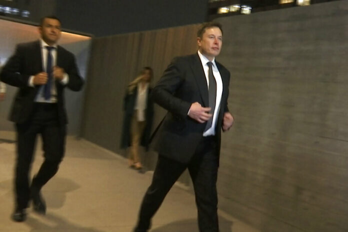 In this frame grab from video, Tesla CEO Elon Musk leaves court, Tuesday, Dec. 3, 2019, in Los Angeles. Musk denied that he meant to call a British cave diver a pedophile when he dubbed him In this frame grab from video, Tesla CEO Elon Musk leaves court, Tuesday, Dec. 3, 2019, in Los Angeles. Musk denied that he meant to call a British cave diver a pedophile when he dubbed him