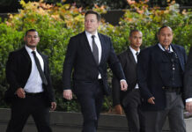 Elon Musk Insists No One Interpreted Tweet to Mean Pedophile Tesla CEO Elon Musk, second from left, arrives at U.S. District Court Wednesday, Dec. 4, 2019, in Los Angeles. Musk is going on trial for his troublesome tweets in a case pitting the billionaire against a British diver he allegedly dubbed a pedophile. Photo: Mark J. Terrill / AP