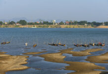 Mekong River’s New Aquamarine Color May Be Sign of Trouble In this Wednesday, Dec. 4, 2019, photo, fishing boats are moored in Mekong River, which has turned blue instead of its usual muddy color, in Nakhon Phanom province, northeastern Thailand. Experts say the aquamarine color the Mekong River has recently acquired may beguile tourists but it also indicates a problem caused by upstream dams. The water usually is a yellowish-brown shade due to the sediment it normally carries downstream. But lately it has been running clear, taking on a blue-green hue that is a reflection of the sky. The water levels have also become unusually low, exposing sandbanks in the middle of the river. Photo: Chessadaporn Buasai / AP