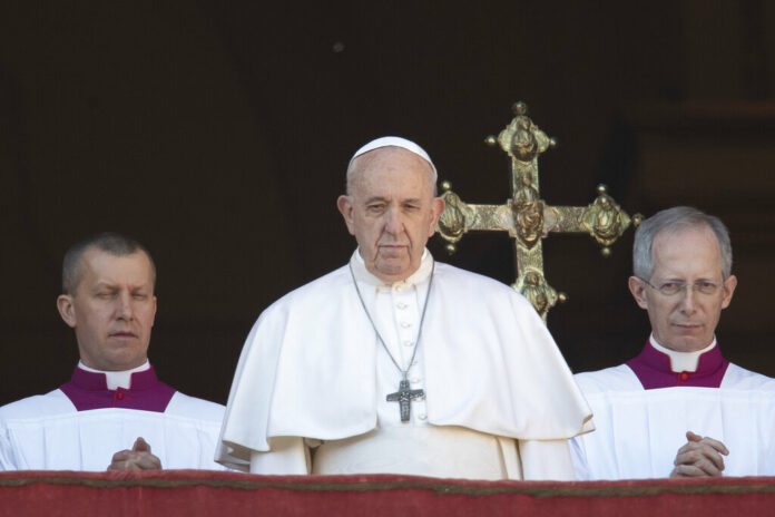 Pope Francis looks at the crowd after he delivered the Urbi et Orbi (Latin for 'to the city and to the world' ) Christmas' day blessing from the main balcony of St. Peter's Basilica at the Vatican, Wednesday, Dec. 25, 2019. Photo: Alessandra Tarantino / AP