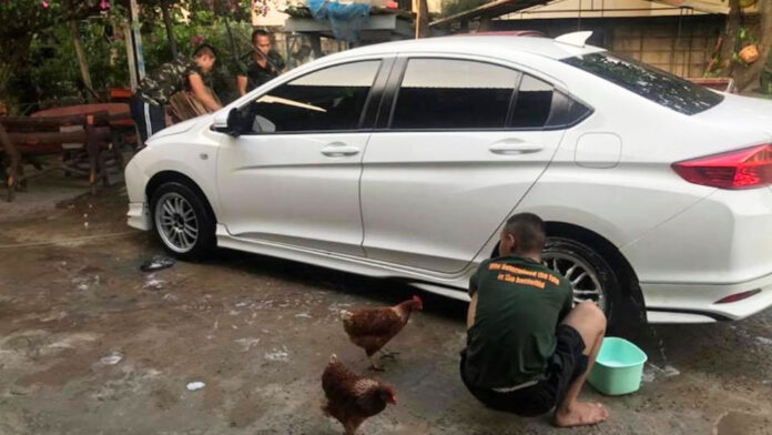 A now-deleted photo originally posted by Facebook user Laphatrada Waka showing draftees allegedly ordered to wash a car at a senior officer’s house.