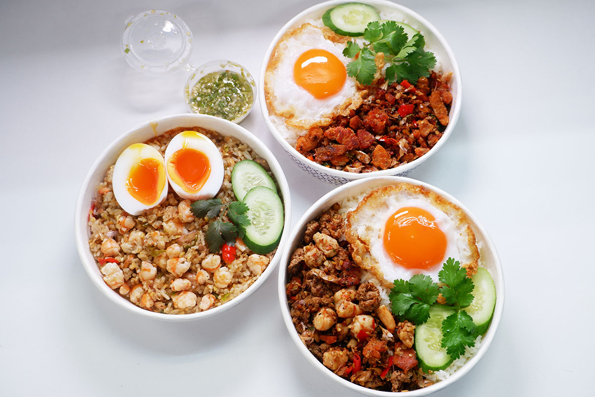 Clockwise from left: shrimp prik-klua fried rice (198 baht), crab roe prik-klua stir-fry over rice (198 baht), and combination prik-klua with jasmine rice (156 baht).