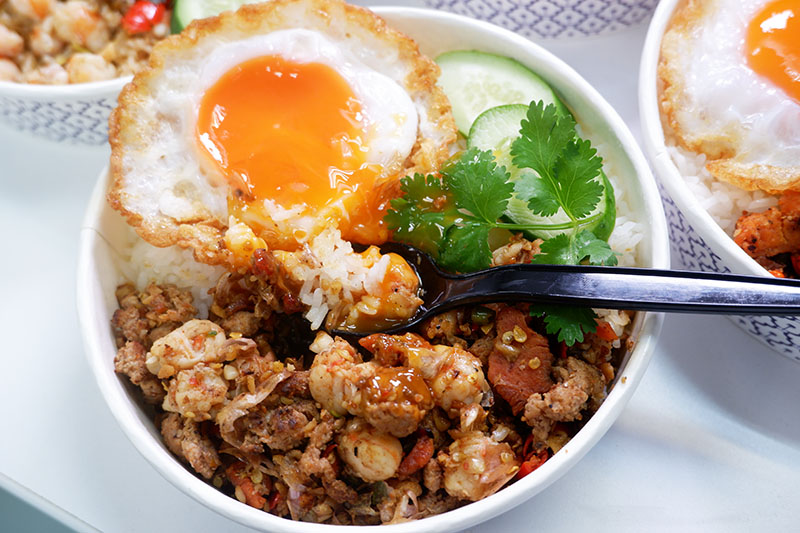 The combination stir-fry with rice and a fried egg (156 baht).